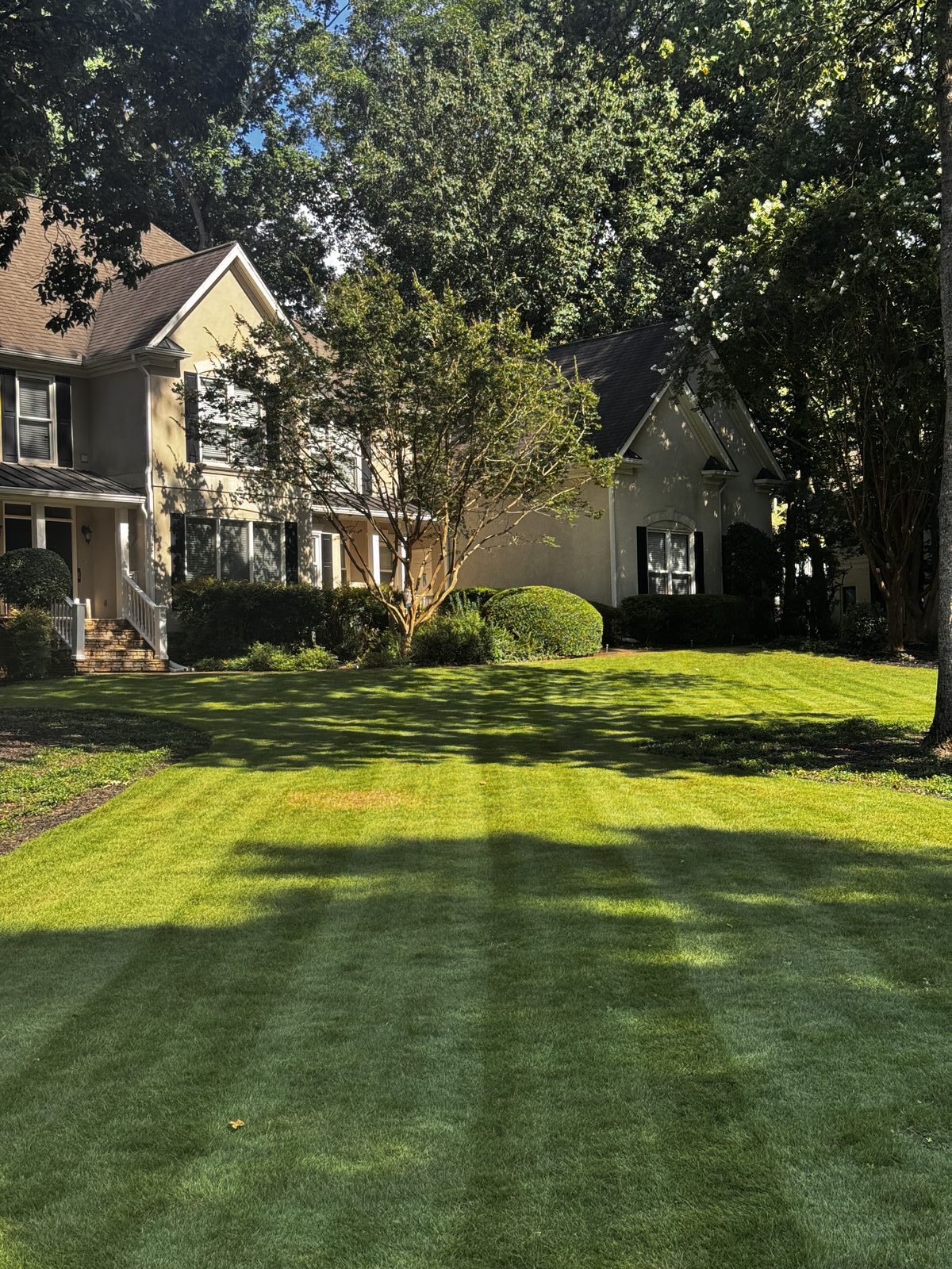 Curb appeal landscaping at a stucco home in Georgia